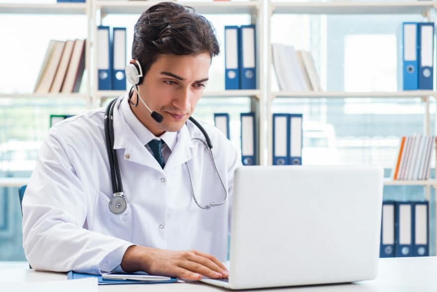 Doctor looking at a computer